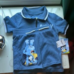 Blue Polo Shirt with White Trim and Graphic Design